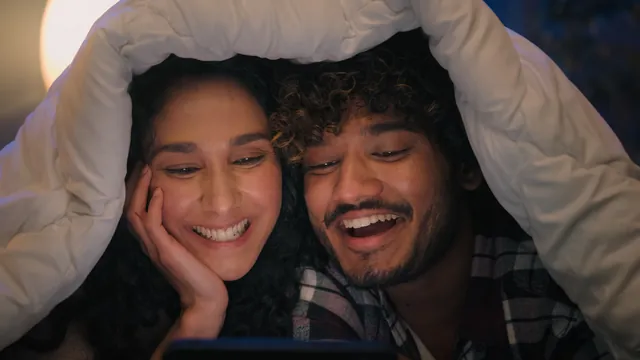 Smiling couple relaxing together at home